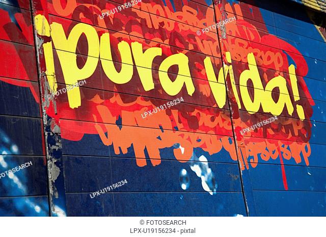 Mural of beer ad with words pura vida