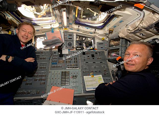 European Space Agency astronaut Frank De Winne (left), Expedition 20 flight engineer, and Doug Hurley, STS-127 pilot, are pictured at Endeavour's aft flight...