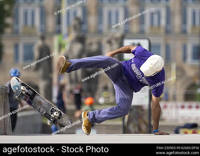 03 September 2023, Saxony, Dresden: Nader Teherani from Hofgeismar crashes during a competition run at the 26th East German Skateboard Championships