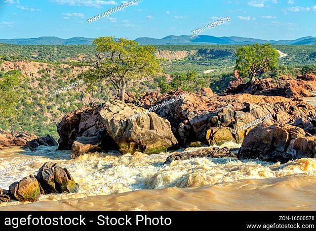on the top of Ruacana Falls on the Kunene River in Northern Namibia and Southern Angola, Africa wilderness landscape
