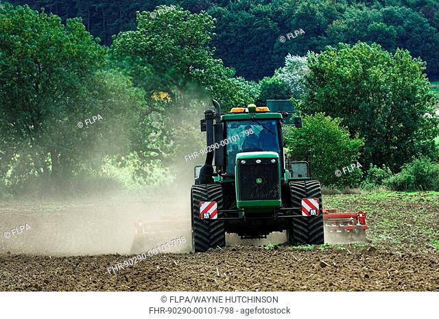 Tractor with crawler tracks, ploughing and cultivating seedbed, England