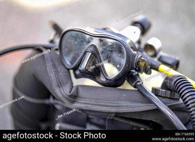 Goggles and oxygen tank with regulator for scuba divers, Spain, Europe