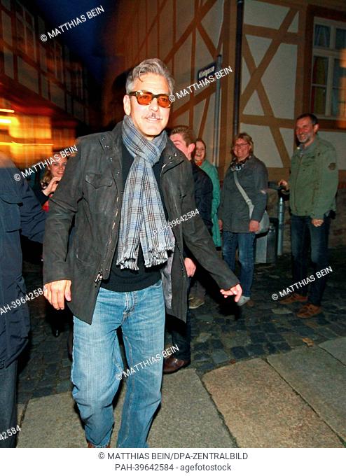 US actor George Clooney leaves a restaurant in Wernigerode, Germany, 18 May 2013. Clooney shoots scenes for his movie 'The Monuments Men' in Germany