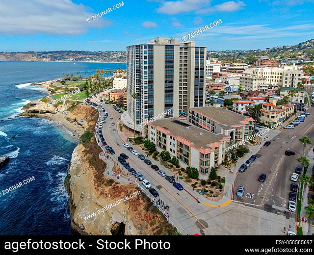 Aerial view of La Jolla coast, San Diego, California. Beach and blue sea with small waves. Hilly seaside of curving coastline along the Pacific