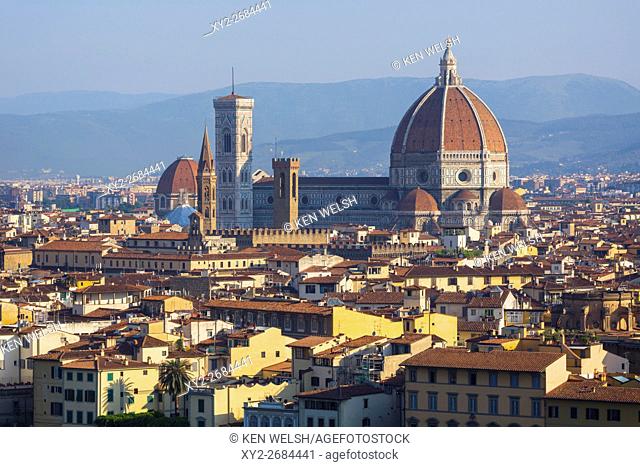 Florence, Tuscany, Italy. View over the city to the Duomo - Cattedrale di Santa Maria del Fiore - and Campanile from the Piazzale Michelangelo