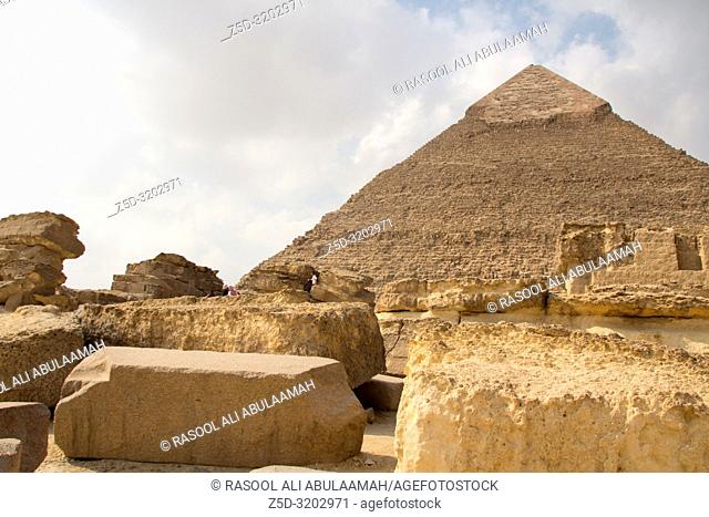 Cairo, Egypt – November 12, 2018: photo for Pyramid of Khufu in the Pyramids of Giza in Cairo city capital of Egypt. And some archeological buildings