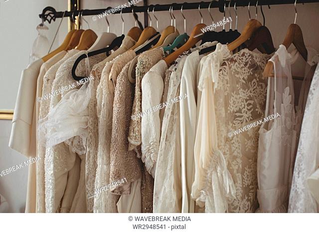 Variety of wedding dresses in wardrobe