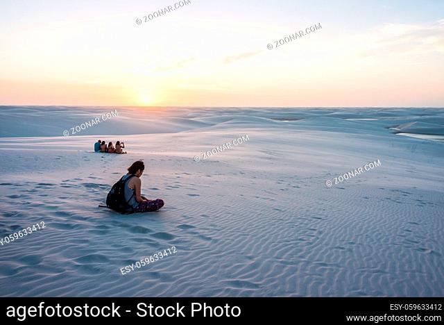Lencois Maranhenses, Brazil, July 13, 2016 - Tourists are saying goodbye to the sun from Sand dunes with blue and green lagoons in Lencois Maranhenses National...