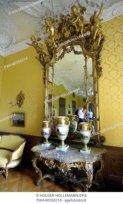 View of vases and a mirror in the Yellow Hall at Bueckeburg Palace in Bueckeburg, Germany, 17 June 2013. In order to finance the upkeep of their princely homes