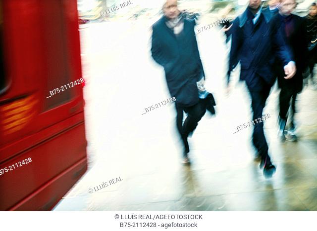Blur urban image of unrecognizable people walking on the street in London, England, UK, Europe