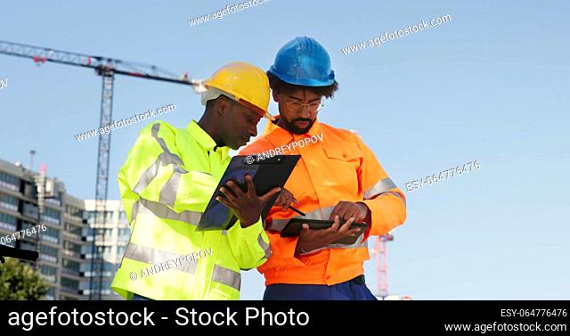 Construct Site Engineer Pointing. Worker Inspector With Clipboard