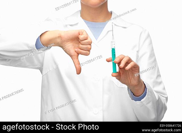 close up of doctor with syringe shows thumbs down