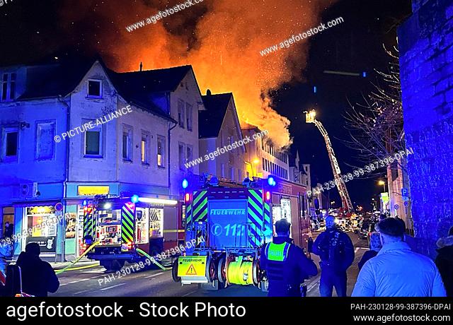 27 January 2023, North Rhine-Westphalia, Bielefeld: Firefighters work on a fire in an apartment building. Several people were injured in a fire in an apartment...