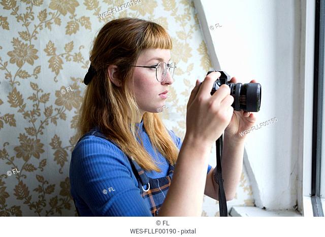 Female student using camera