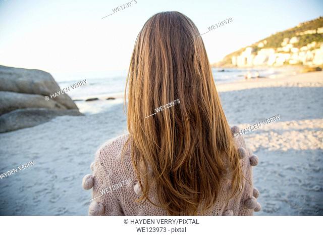 Young Woman Sat On Beach
