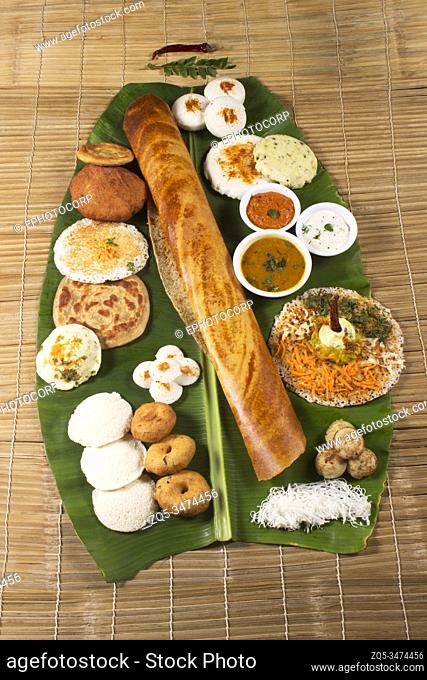 Traditional South Indian snacks, Dosa, idli, medu wada on banana leaf