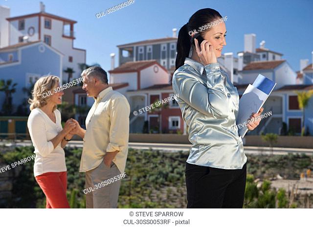 Realestate agent talking on mobile phone
