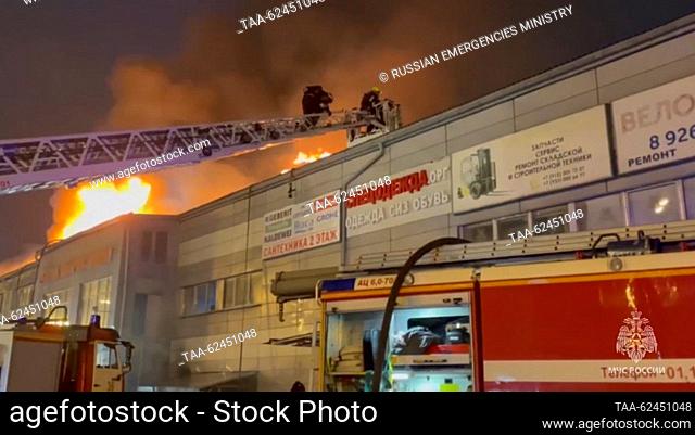 RUSSIA, MOSCOW - SEPTEMBER 21, 2023: Firefighters battle a fire in an unfinished building in the town of Shcherbinka. Video grab