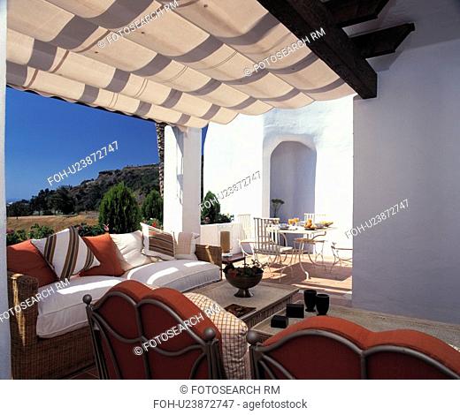 Seating and furniture on patio of Spanish villa