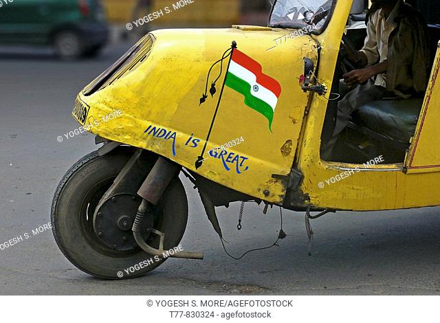 Indian Tricolor Flag painted on a Mad max local transports vehicle along the road Bhopal, Madhyaprsdesh, India