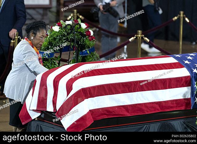 United States Representative Sheila Jackson-Lee (Democrat of Texas), reaches out to touch the flag-draped casket bearing the remains of Hershel W