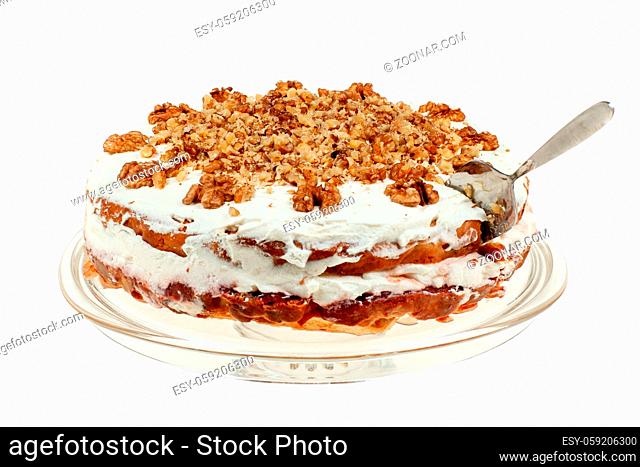 Delicious cake with apple and whipped cream filling, topped with nuts
