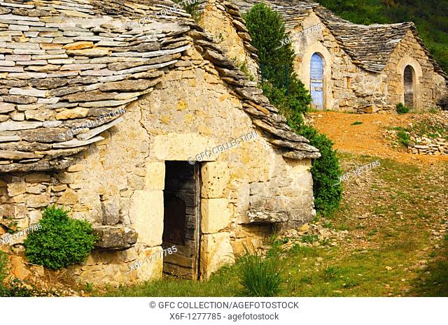 Abandoned semitroglodyte wine cellars with a natural stone roof in Entre-deux-Monts near Riviere-sur-Tarn, Aveyron, France
