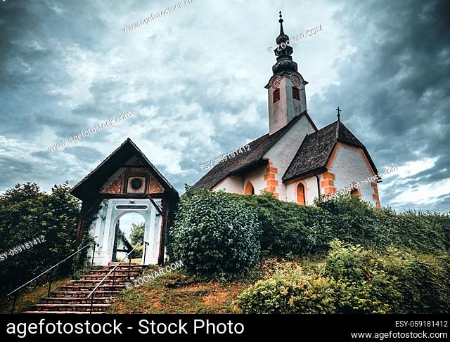 Church of Maria Worth at Lake Woerthersee near Velden in Austria during Summer - in the morning