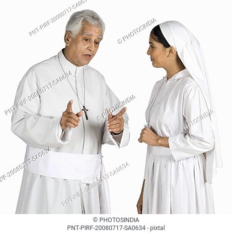 Priest talking to a nun