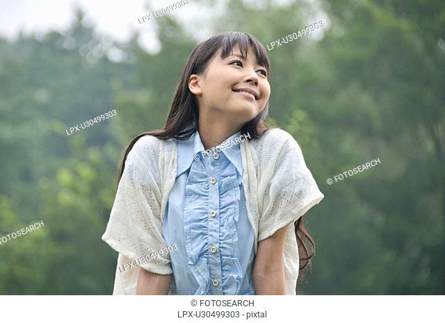 Young Woman Enjoying Herself Outdoors