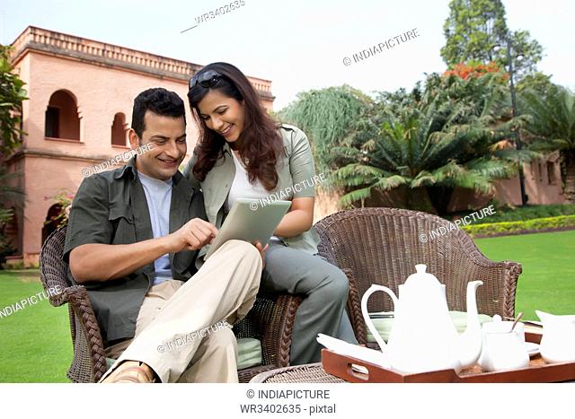 Couple looking at digital tablet