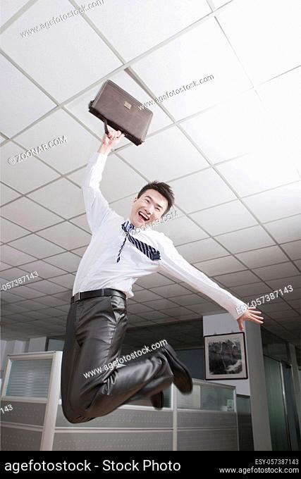 Portrait of a young business manJumping high quality photo