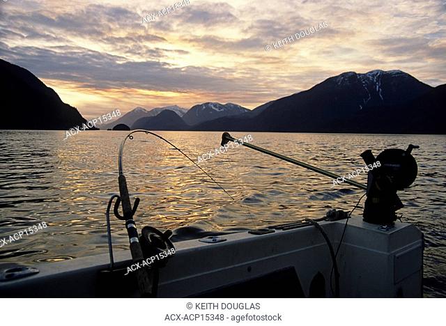 Salmon fishing with downrigger at sunset, Knight Inlet, British Columbia, Canada