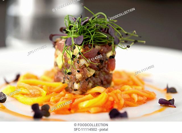 Tuna avocado tartar on ginger carrots with bean sprouts