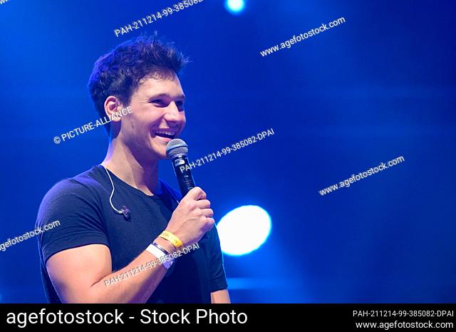 14 December 2021, Hamburg: Singer Wincent Weiss moderates on stage. Numerous well-known musicians and up-and-coming artists rocked the stage of Hamburg's...