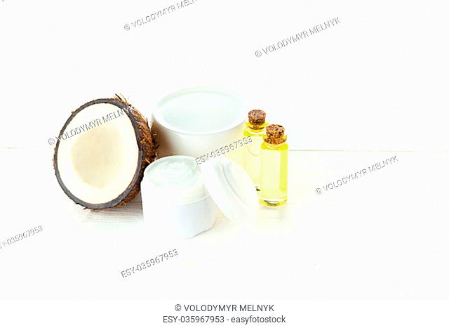 Natural coconut oil and spa concept on wooden table