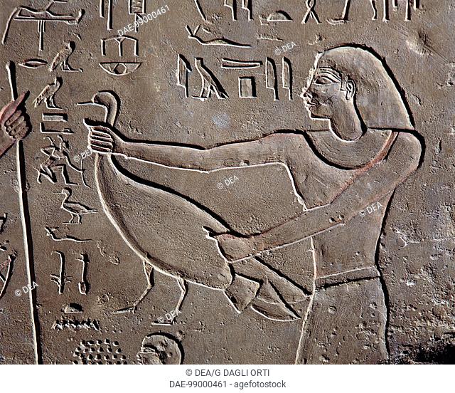 Egyptian civilization, Old Kingdom, Dynasty VI - Limestone stele of Hagi. Detail of a relief depicting the deceased and his son making offering