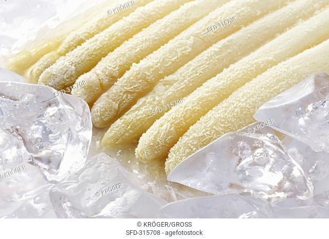 Frozen asparagus on ice