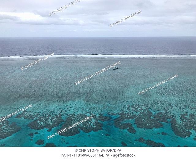A beached ship on a reef can be seen before the Fiji Islands, 20 October 2017. The island state is host to the World Climate Conference COP23 which is to start...