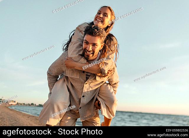 happy couple having fun on summer beach