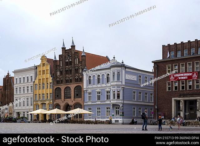 23 June 2021, Mecklenburg-Western Pomerania, Stralsund: Listed gabled houses on the market square in Stralsund. First mentioned in 1234