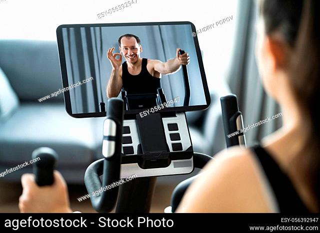 Woman Training On Elliptical Trainer Online At Home