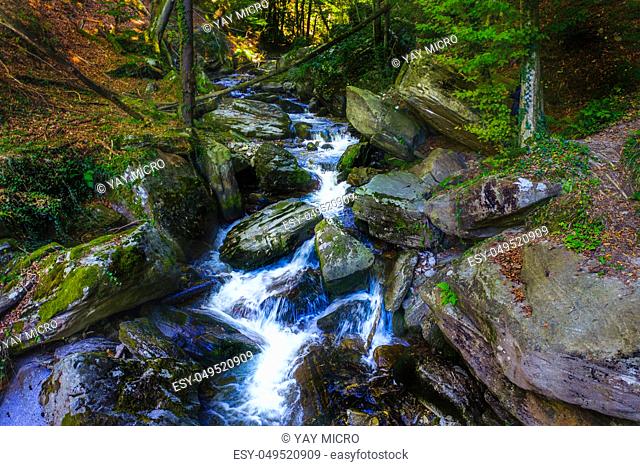 Mountain river flowing over rocks and boulders in forest, Bistriski Vintgar gorge on Pohorje mountain, Slovenia, hiking and outdoor tourism landmark