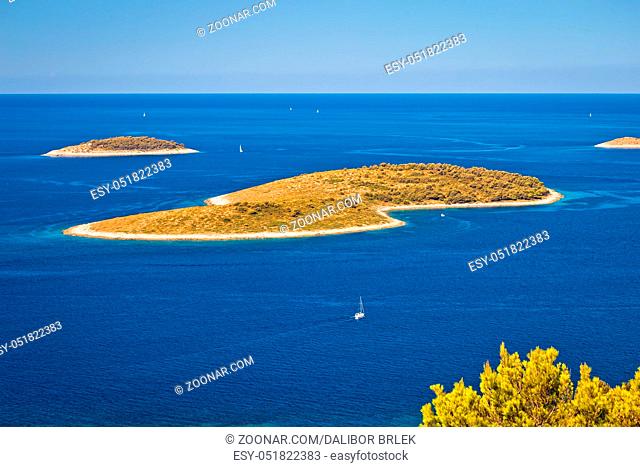 Islands in blue sea aerial view near Primosten archipelago, Dalmatia, Croatia