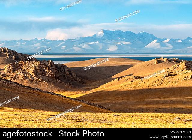 tibet plateau landscape of holy lake and snow mountain at dusk in Namtso