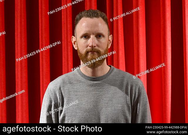 25 April 2023, Bavaria, Munich: Filmmaker Julian Vogel stands in the City Kino after the DOK.fest Munich press conference