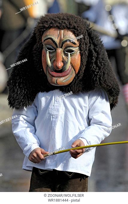 historical wooden mask at carnival parade