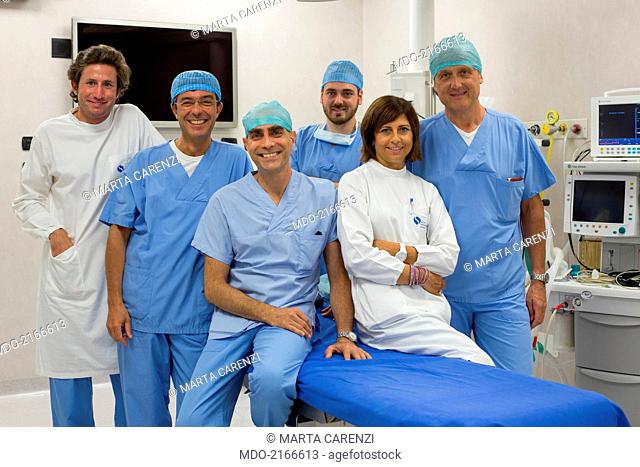 Dentist's staff in white and blue coats. Milan (Italy), 27th July 2014