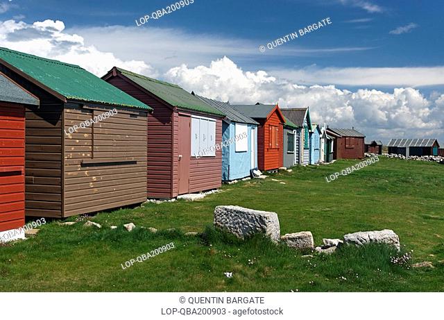Beach huts at Portland Bill in Spring. Portland is a large Limestone outcrop off the Dorset coast. It is very windswept and has been shaped by several thousand...
