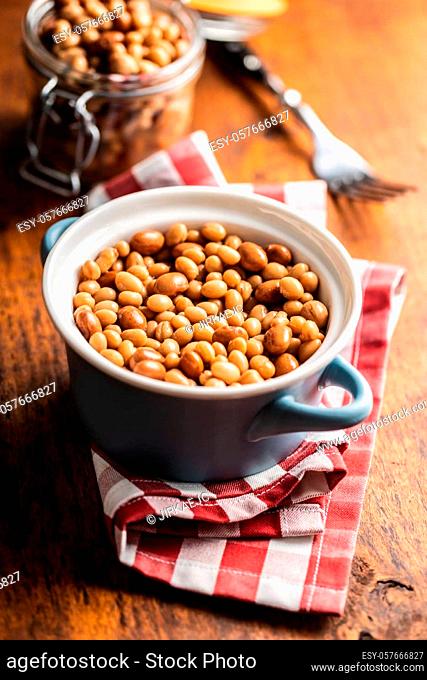 Mix of legume beans and chickpeas with sauce in a pot